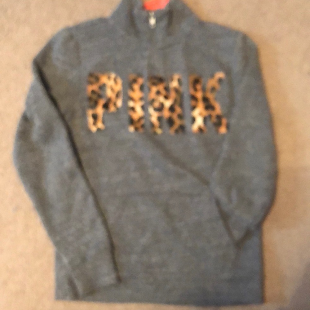 Grey sweatshirt with cheetah print words.